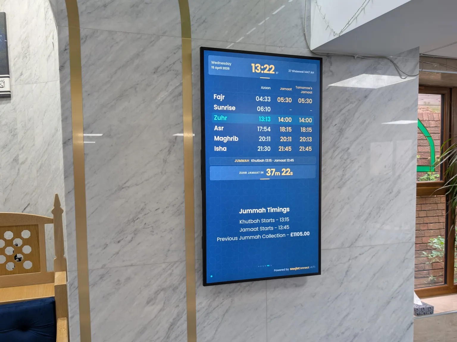 A portrait MasjidConnect screen by the minbar at Lye Ghausia, showing Jumu'ah timings